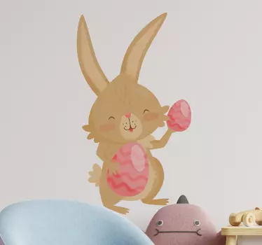 Påskehare, der holder lyserødt æggemærkat - TenStickers