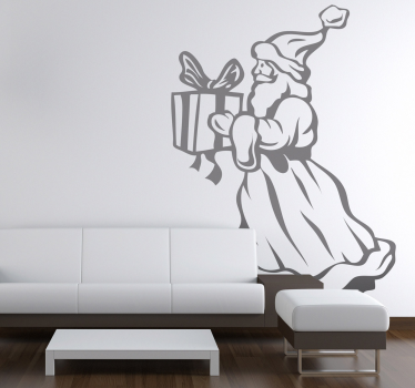 Santa claus holder nuværende klistermærke - TenStickers