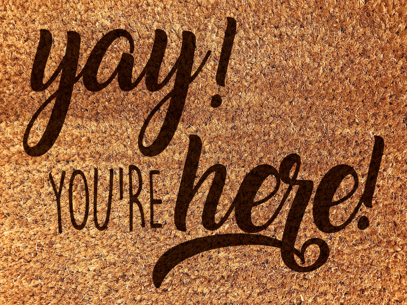 Varm velkomstfrase vinyltæppe til entre - TenStickers